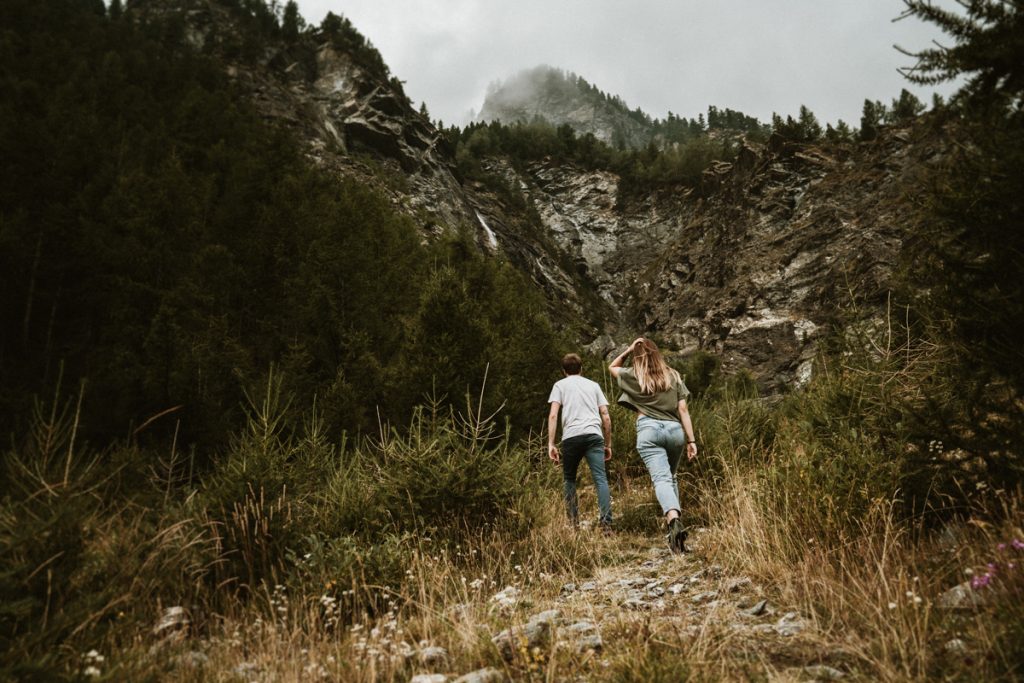 As mountain lovers, getting to photograph a pre-wedding session in the Italian Alps is what makes our days special! These two wonderful guys share our same passion and love for the outdoors, so we chose together a setting that best could convey this love of theirs. The Italian Alps are an endless source of inspiration and an infinite playground for us, they offer the best settings for adventurous elopements and adventurous sessions for those couples looking for an alternative way to celebrate their love! Our "side" of the alps is certainly not as famous and well known as the Dolomites and it is definitely not as popular as the western side when it comes to eloping. This does not mean, not for a bit, that they are less beautiful or less dramatic than their western sisters. In fact, they might even be a better option especially during those busier months of the year as the amount of tourists here is consistently lower.