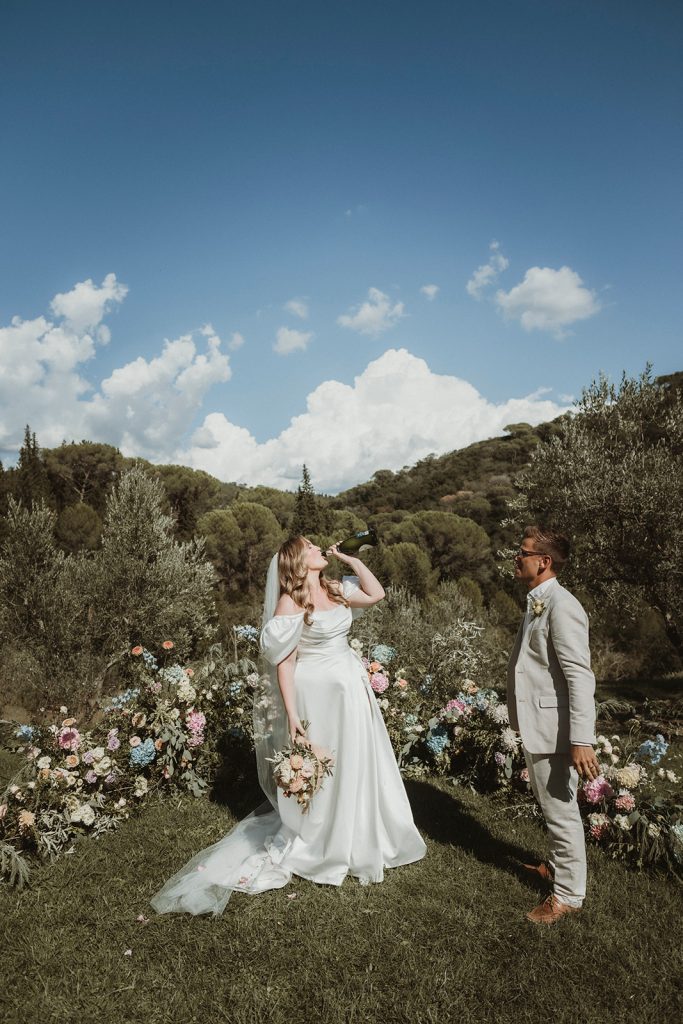 couple toasting on their elopement day in Italy