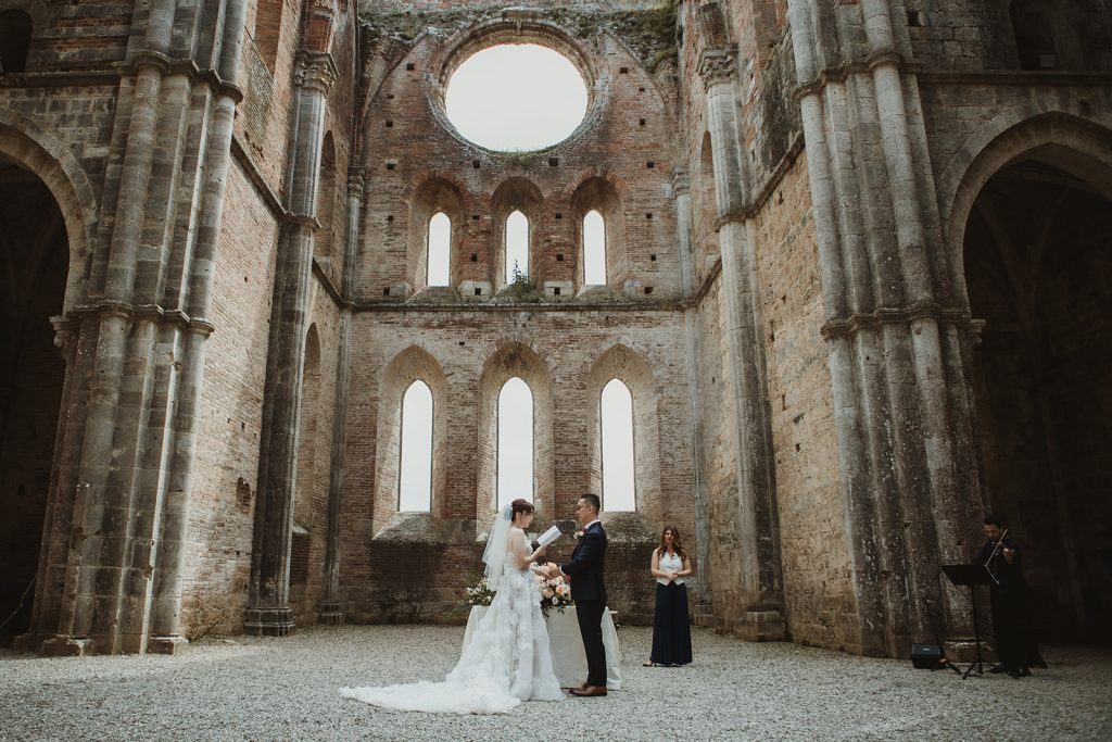 Bride and Groom exchanging vows on their civil ceremony at San Galgano, for an elopement in Tuscany