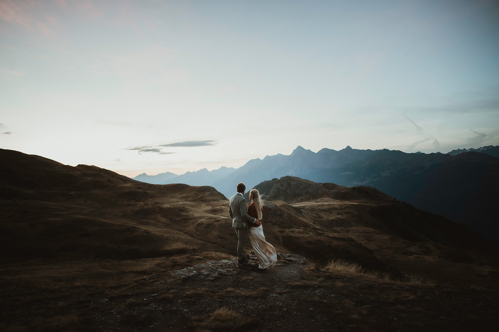 Sunrise elopement ceremony above the clouds in the Italian Alps.