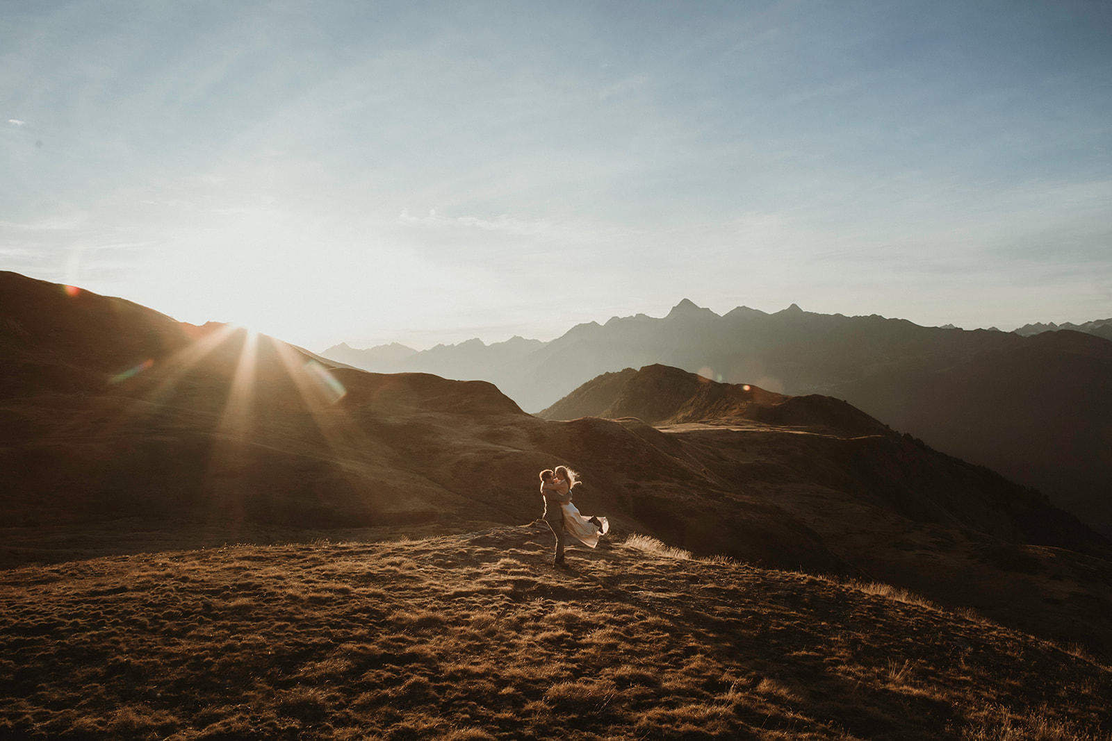 Couple celebrating their union at sunset during their elopement in the Italian Alps