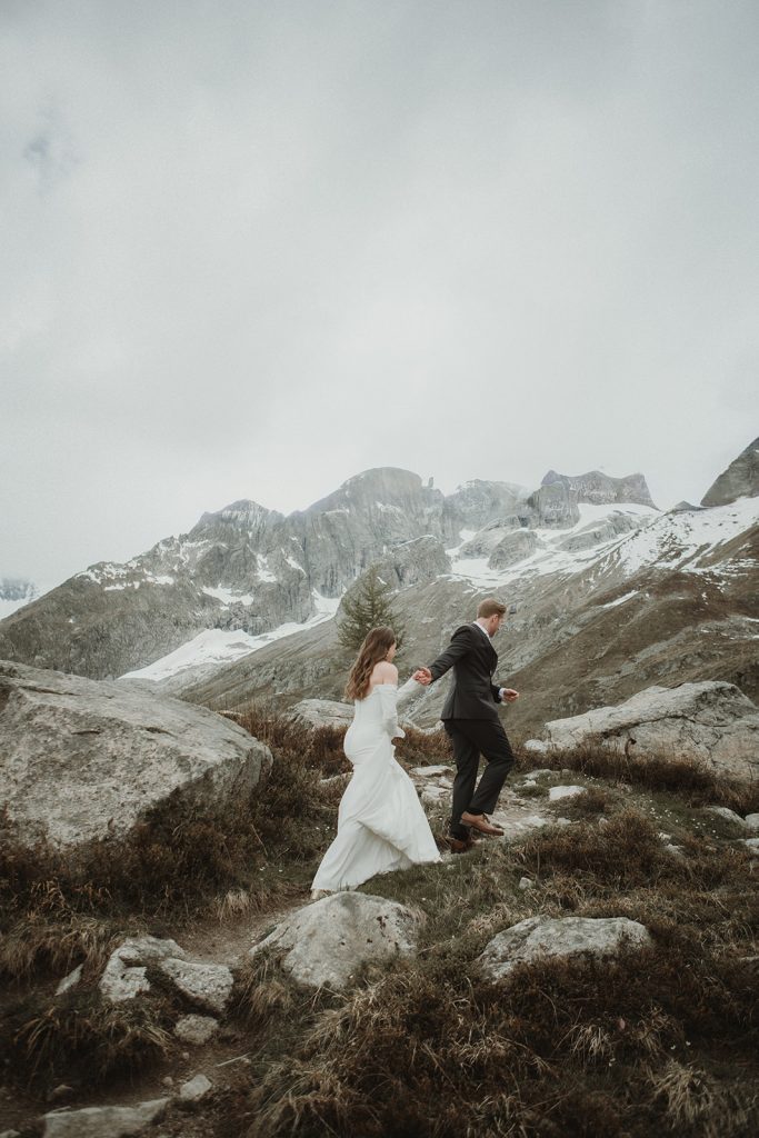 Couple walking through the highest botanical garden in Europe during their Mont Blanc elopement on the Skyway.