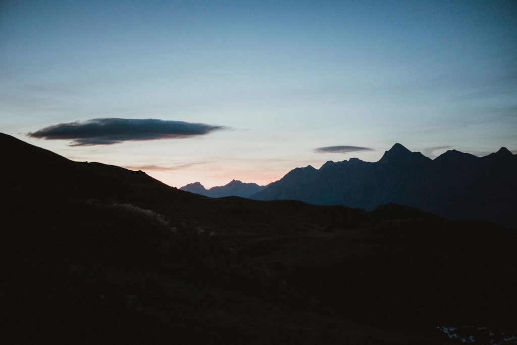 Sunrise over the Aosta Valley in Italy during a mountain elopement, showcasing alpine peaks and morning light