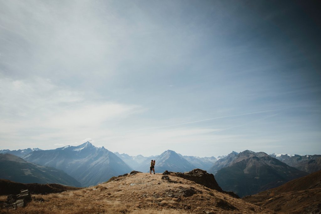 Holly and Loz celebrating their mountain elopement with panoramic views of the Italian Alps
