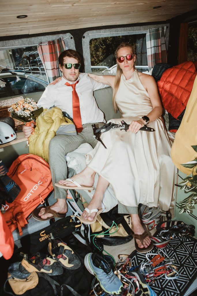 Wedding details from a mountain elopement in Italy, including rings, bouquet, and alpine scenery