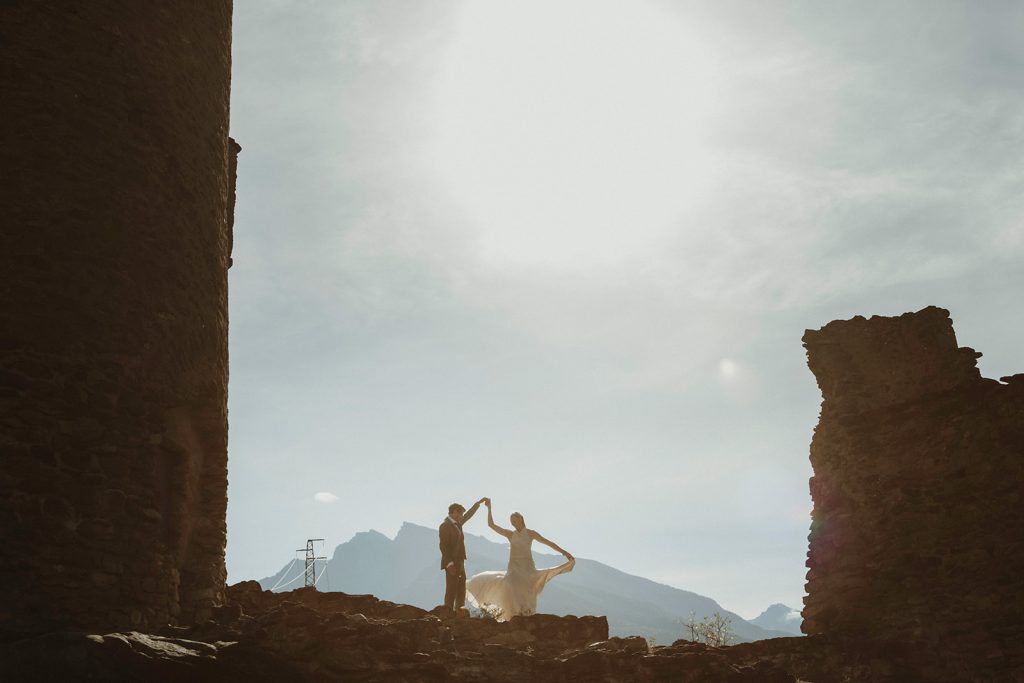 Couple photographed at sunset at Villeneuve Castle, celebrating their adventure elopement in Italy
