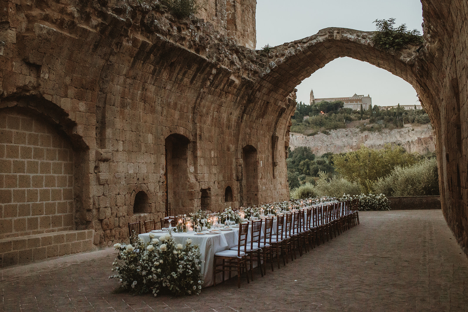 Rustic chic wedding table in ancient ruins in Italy