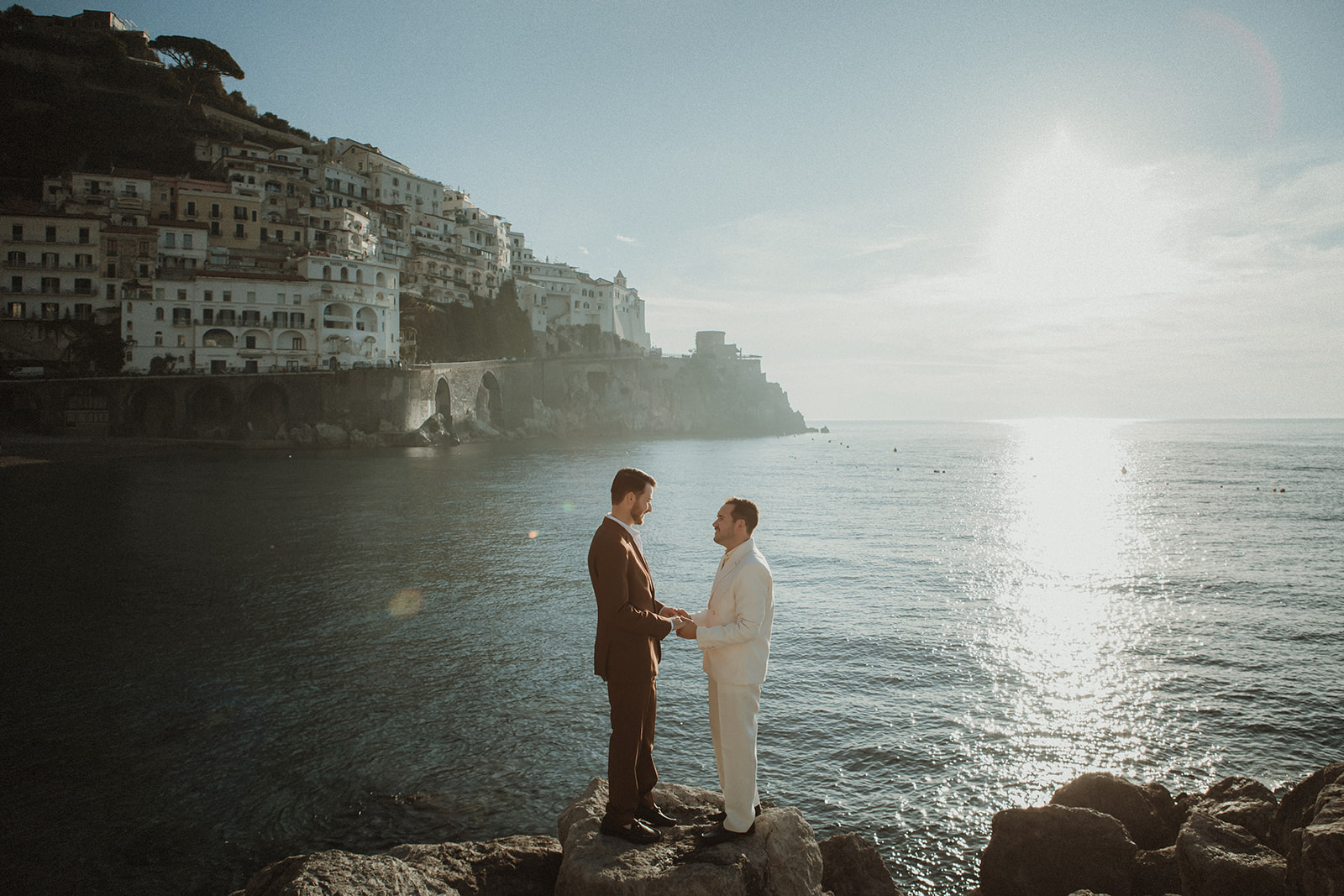 Couples exchanging vows at dawn in Amalfi to keep costs effective on their elopement in Italy