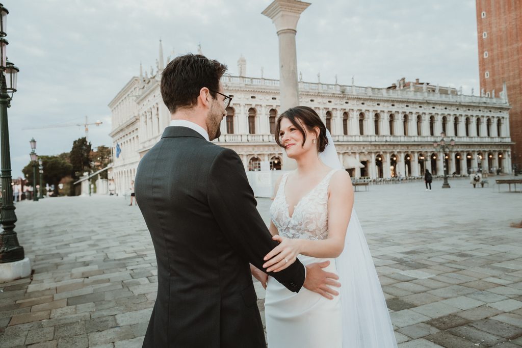 Bride emotionally looking at the groom right after their first look in Venice