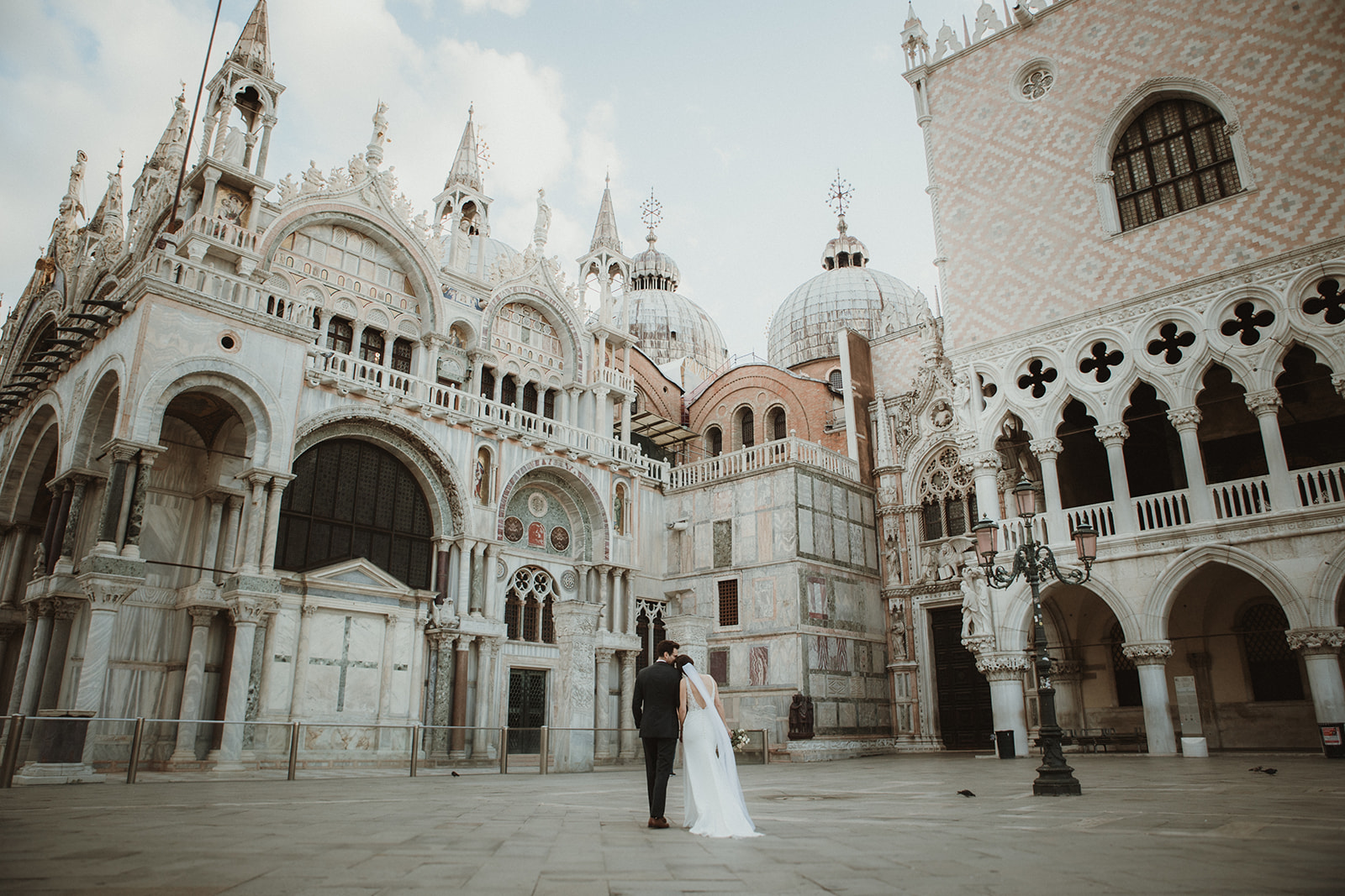 Sunrise elopement in Venice Venice Elopement - Couple enjoying the Piazza San Marco on their sunrise elopement