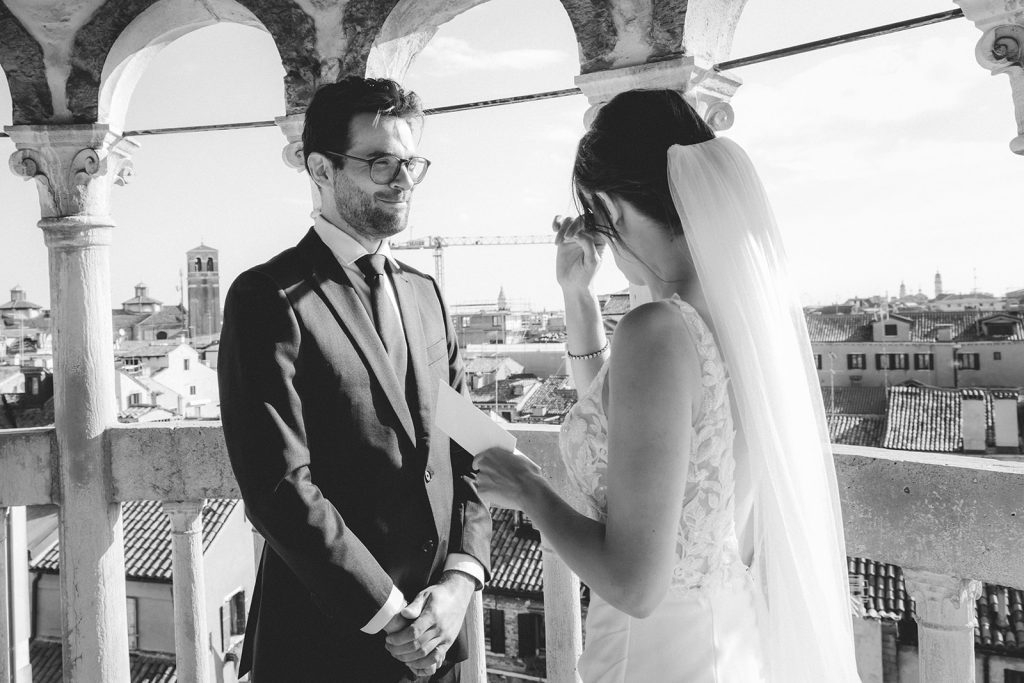 Bride getting emotional as she says her vows during a symbolic ceremony at Palazzo Contarini del Bovolo