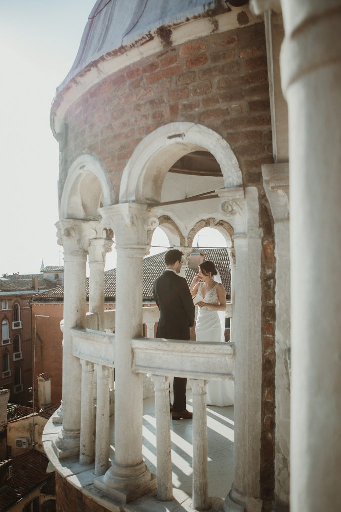 Bride getting emotional as she says her vows during a symbolic ceremony at Palazzo Contarini del Bovolo