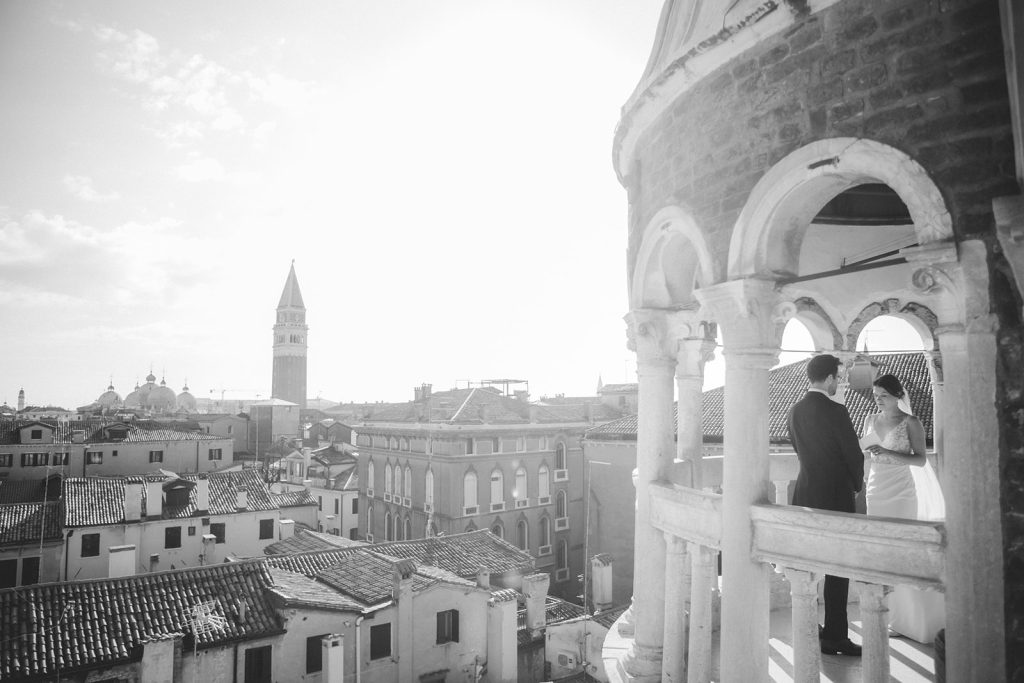 Incredible morning views of Venice with couple exchanging vows during their morning elopement at Palazzo Contarini del Bovolo