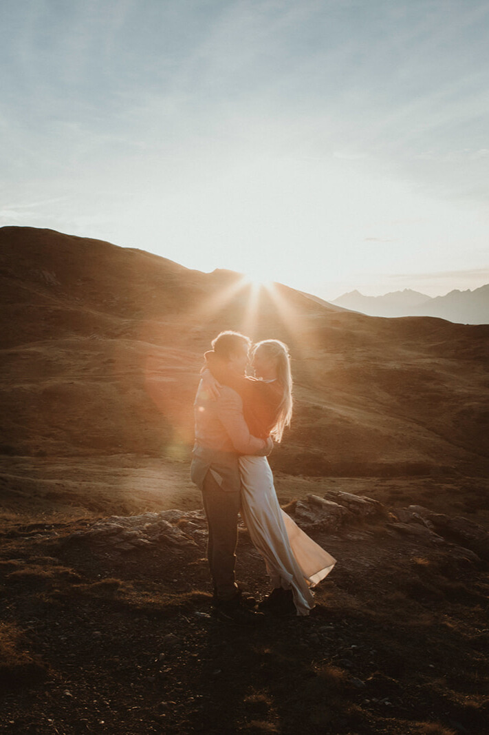 Couple embracing at sunset during an intimate elopement experience in Italy