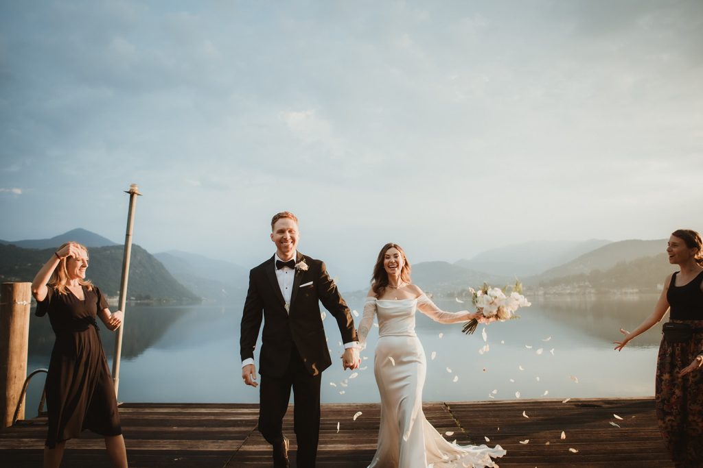 confetti shot by a Northern Italy lake at dawn during an elopement