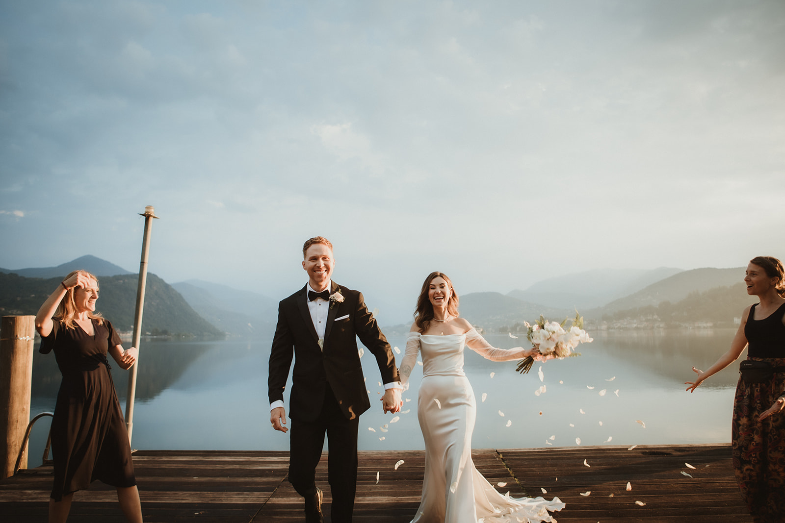confetti shot by a Northern Italy lake at dawn during an elopement