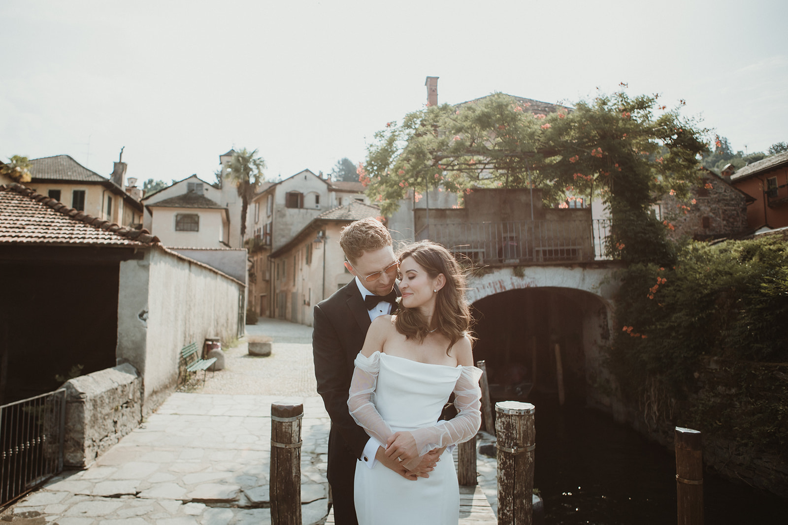 Couple embracing in a typical setting of a lake town in Northern Italy