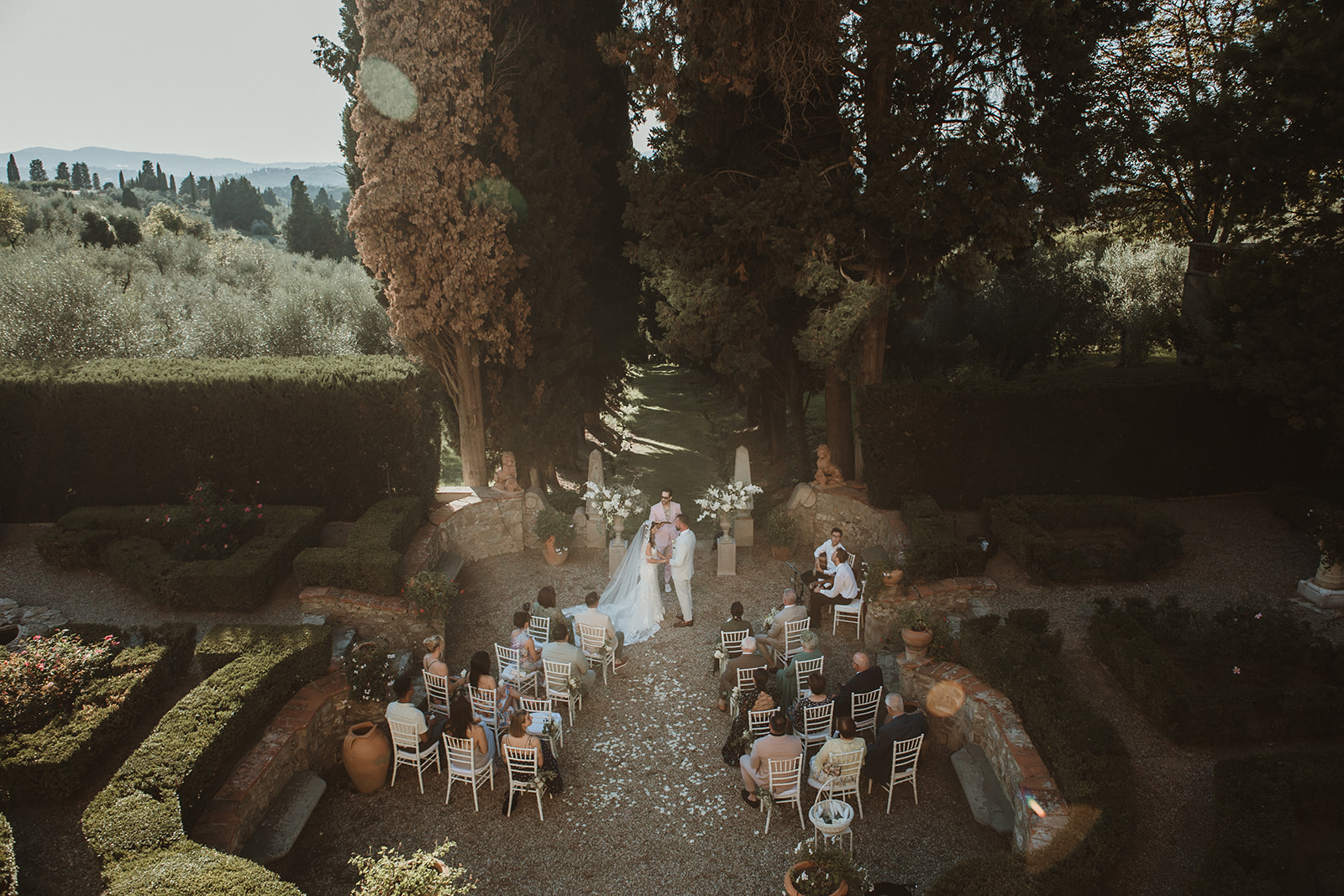 Symbolic ceremony during an intimate wedding in Italy held in a uscan Villa during golden hour